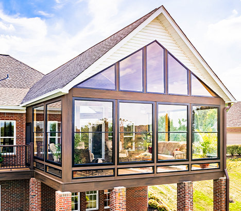 A beautiful, raised a-frame sunroom photographed on a sunny day